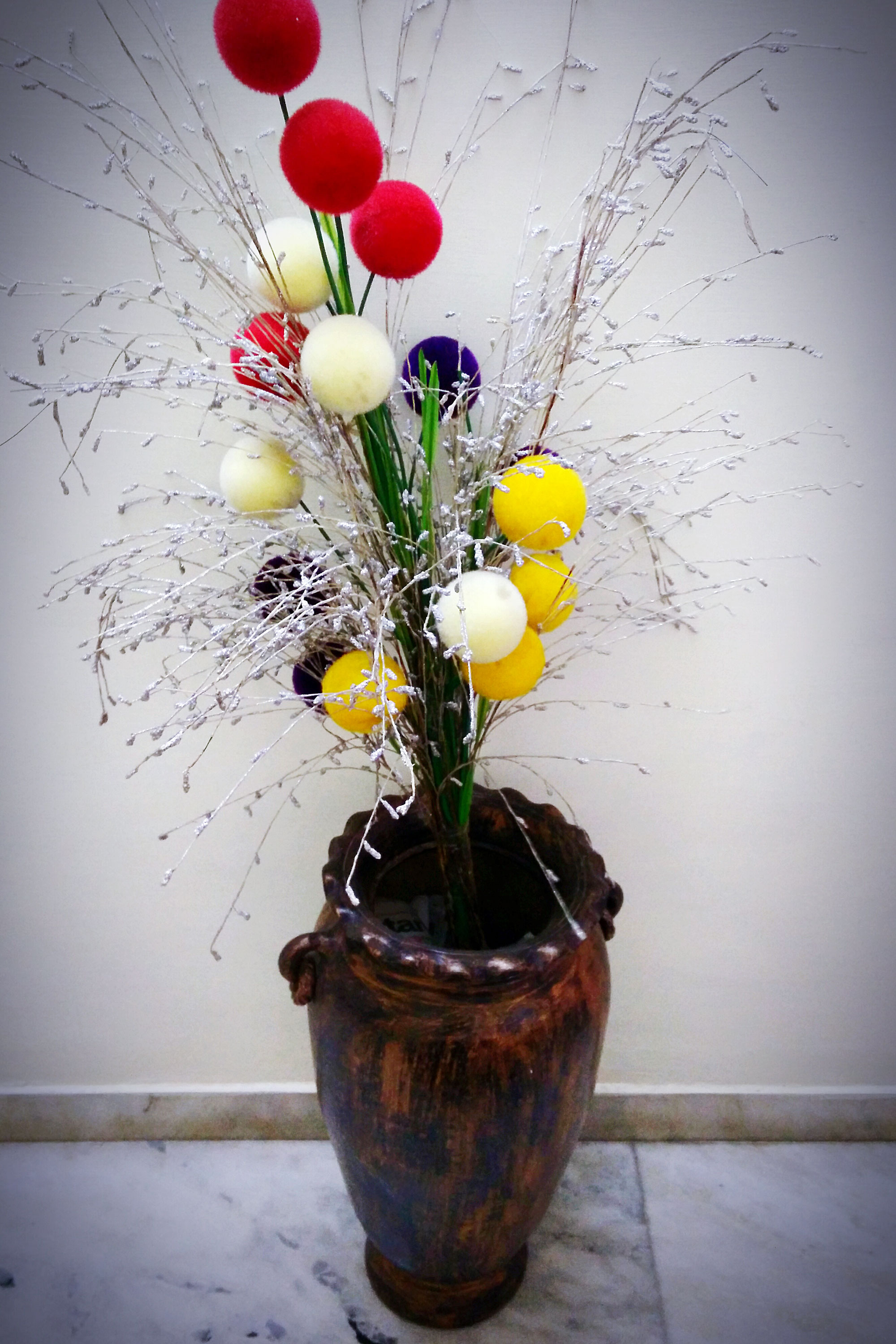 Flower vase with artificial elements